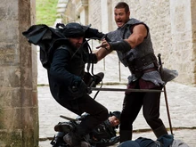 Defeating a  while unarmed.