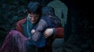 Merlin carrying Freya through the isle of the blessed