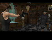 Meryl is controlled into holding Snake at gunpoint.