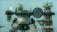 Metal Gear ZEKE charging the railgun. Equipped with all standard ZEKE main and optional components but with the head of the Cocoon and legs of Peace Walker. Normal color scheme. Photographer has taken cover to avoid a potentially fatal hit.