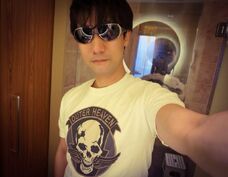 Kojima wearing a limited edition Outer Heaven T-shirt #1.