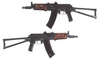 Two AKS-74us with stocks folded out.