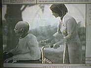 Para-Medic helping a man in a wheelchair.