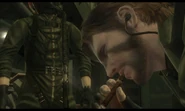 Snake smokes a cigar on board an aircraft during a cutscene.