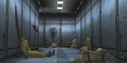 The hallway leading from the western labs, strewn with the corpses of Genome Soldiers killed by Gray Fox.