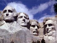 Mt. Rushmore presidents from left to right: George Washington, Thomas Jefferson, Theodore Roosevelt, Abraham Lincoln.