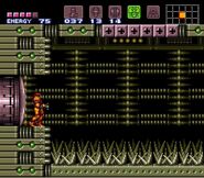 Spikes on the floor of the Wrecked Ship force Samus to traverse with the Grapple Beam.