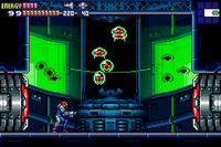 Metroid specimens behind green-tinted glass containment units.