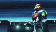 The loading cutscene that plays when riding a Shuttle. Samus will stand facing either left or right depending on the direction the Shuttle is going.[1]