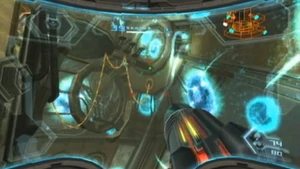 Samus targets the cable connecting one of the arms to the Bomb Component.