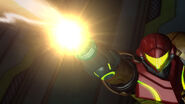 Samus fires the Grapple Beam into the Queen Metroid's mouth.