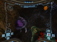 A purple Fission Metroid stuck inside a wall.