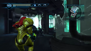 Samus enters the containment room, with James and K.G. examining something.