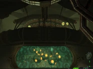 A device on the central wall, behind a shield.