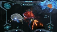 An Ice Metroid and Plasma Metroid within the Phazon Mines in Metroid Prime Remastered.
