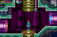 Zero Suit Samus uses a Save Station on board the Space Pirate Mother Ship in Metroid: Zero Mission.
