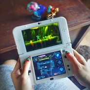 Yang playing Samus Returns.[9]