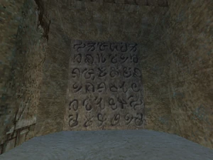 , on the far left wall.