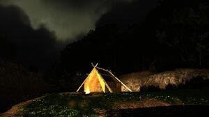 Campfire by a lonely hut