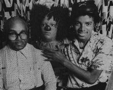 Michael Jackson with his Grandfather holding the prop Scarecrow head
