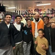 Common taking a photo with the actors who play The Jacksons