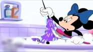 Minnie desperately tries to wash dye off pluto