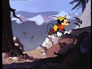 Mickey climbing a mountain