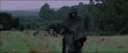 Aragorn leading Hobbits