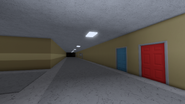 Right side corner of the school.