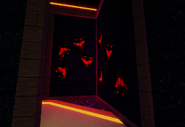 A picture of random red faces in the corner of the maze.