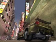 TorqueJXTokyo.jpg (9 KB) A yellow Torque JX cruising through one of the many Tokyo alleyways.