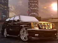 A Cadillac Escalade posing parked.