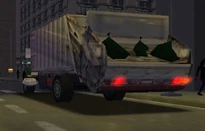 MCSR Peterbilt 330 Garbage Truck Rear.jpg (29 KB) Rear view of a Peterbilt 330 Garbage Truck with three trash bags inside it. It is driving in New York City.