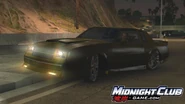 A black Grand National GNX at night.
