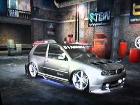 A modified Volkswagen Golf R32 in the garage.