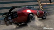 Rear view of a red modified Datsun 280Z violently turning onto a street in Los Angeles.