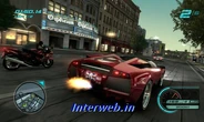A Lamborghini Murcielago and a sports bike race past the Orpheum Theatre in in-game Los Angeles.
