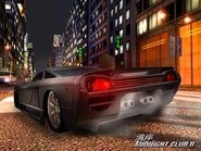 Veloci02.jpg (126 KB) A black Veloci powersliding through Tokyo. Notice the quad exhausts and different grille.