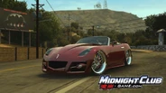 A Pontiac Solstice races in in-game Los Angeles.