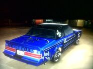 A rear view of a customized Buick Grand National GNX.