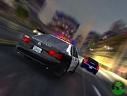 A San Diego Police car (SD Cop) chasing a Chrysler 300C during a race in San Diego.