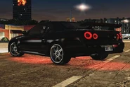 A lightly customized black Nissan Skyline.