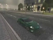 A green Victory cruising through Paris.