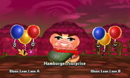 A Hamburger Surprise boss in battle with its cohorts, two Bloon Loon Loons.