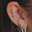 Miley-cyrus-love-ear-tattoo.jpg