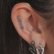 Miley-cyrus-love-ear-tattoo