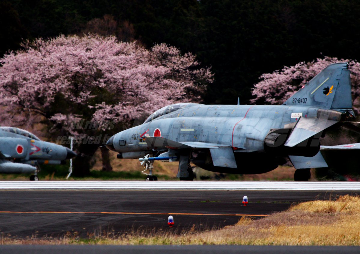 A pilot remotely controls a Q-F4 Phantom as it takes off from the