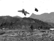 C-7 Caribou 62-4161 plunges to earth after being struck by  artillery, 3 August 1967. Photo by Hiromichi Mine.