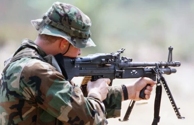 US Navy SEAL fires M60E3 machine gun