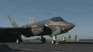 A F-35C launching off a aircraft carrier